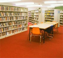 Photo of girl writing on notebook